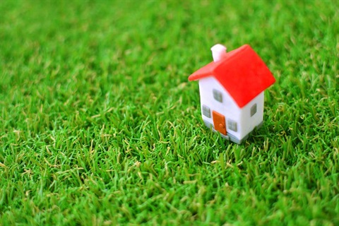 Miniature-Toy-House-On-A-Green.jpg